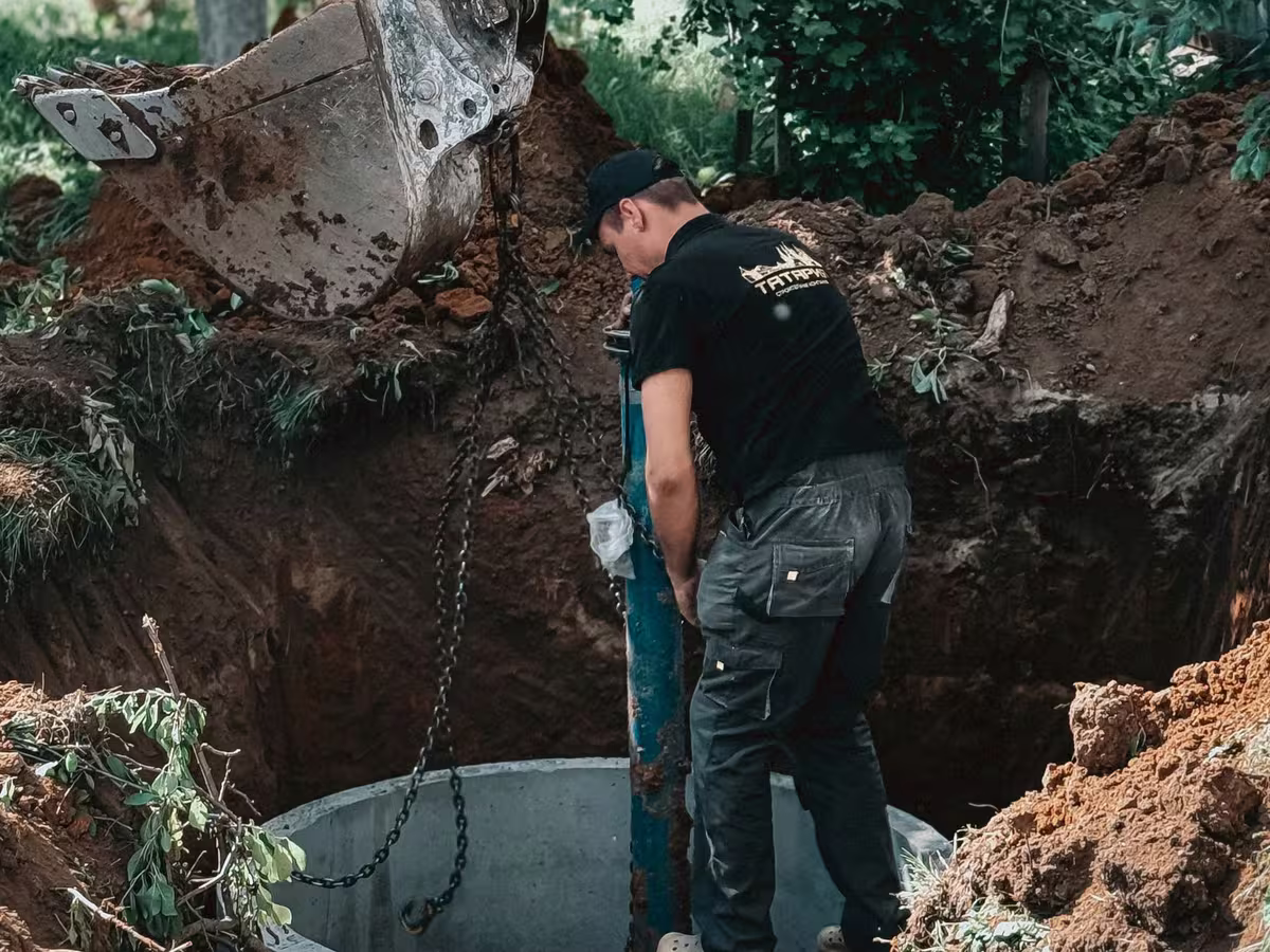 A concrete chamber being set into an excavated site